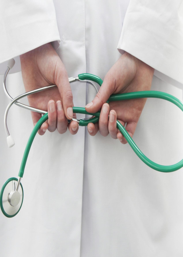 A healthcare professional holding a stethoscope